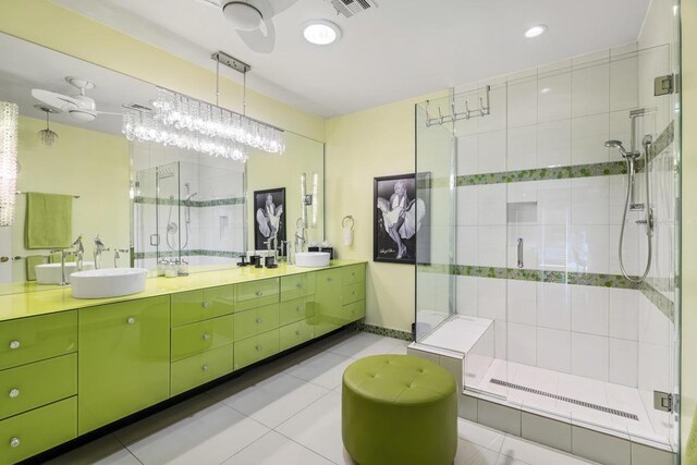 bathroom featuring tile patterned flooring, vanity, and an enclosed shower