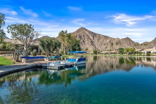 view of dock featuring a water and mountain view