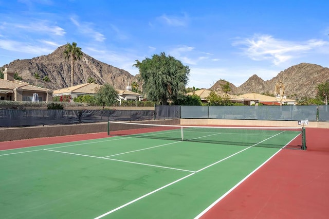 view of tennis court with a mountain view and basketball court