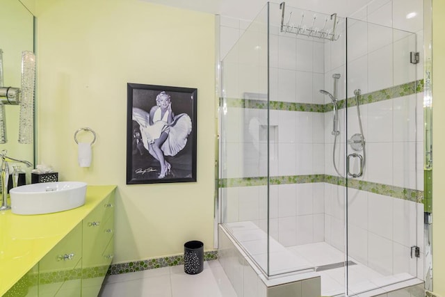 bathroom with vanity, tile patterned floors, and a shower with shower door