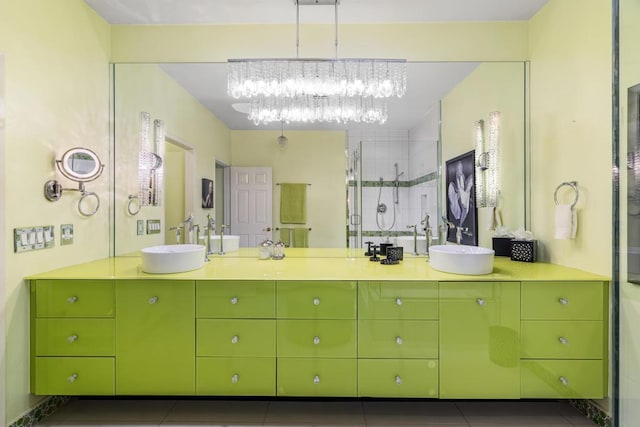 bathroom with tile patterned floors, vanity, and a shower with shower door