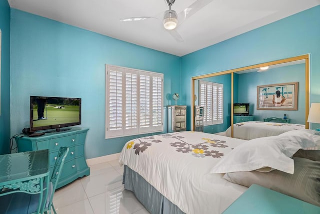 tiled bedroom with ceiling fan