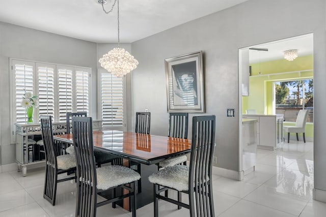 dining room featuring light tile patterned floors and a chandelier