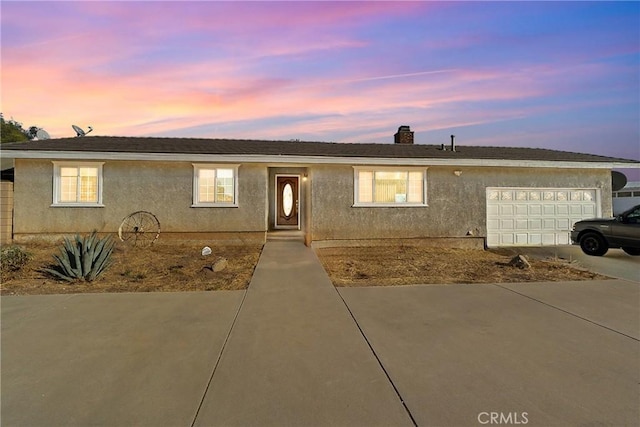 ranch-style house featuring a garage