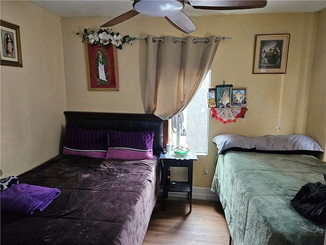 bedroom featuring wood finished floors