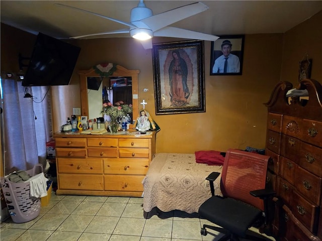bedroom with a ceiling fan and light tile patterned flooring