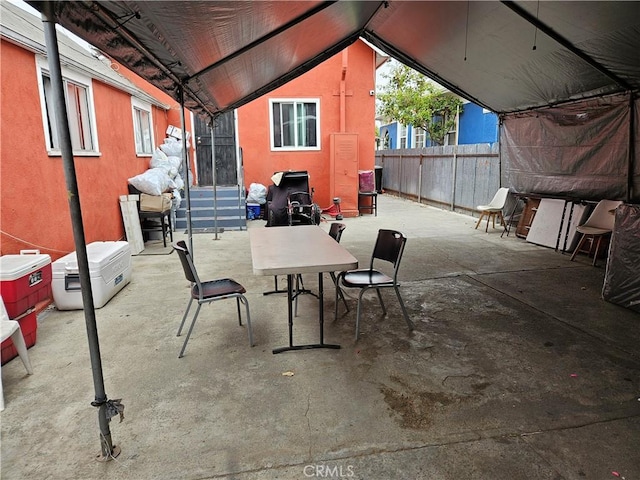 view of patio / terrace featuring entry steps and fence