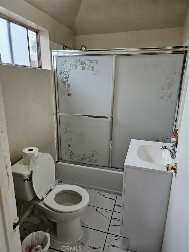 full bath featuring combined bath / shower with glass door, marble finish floor, vanity, and toilet