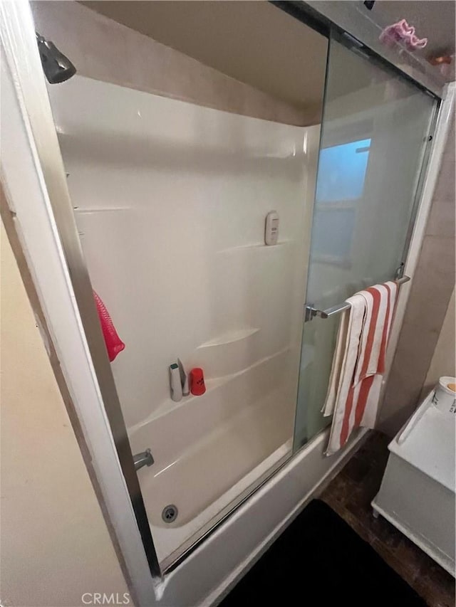 bathroom featuring enclosed tub / shower combo