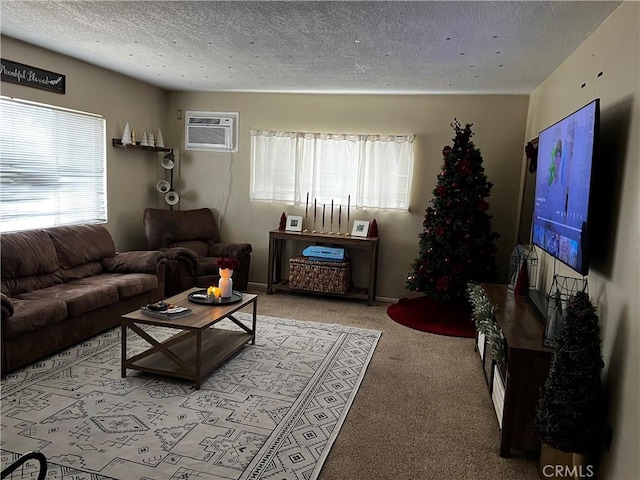 carpeted living room featuring a textured ceiling and a wall mounted AC