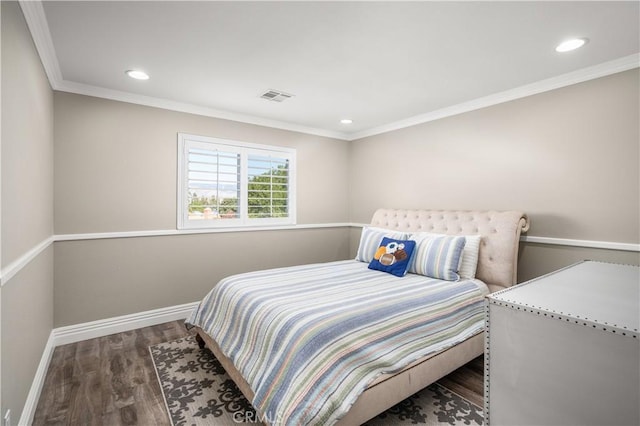 bedroom featuring dark hardwood / wood-style floors and crown molding