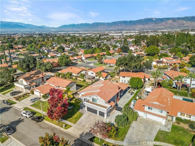 birds eye view of property with a mountain view