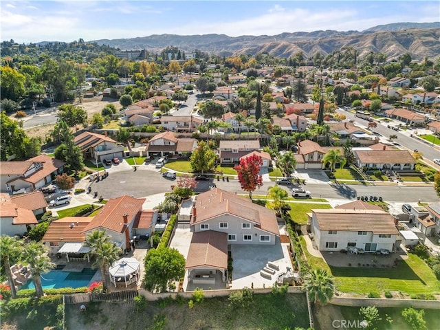 drone / aerial view with a mountain view and a residential view