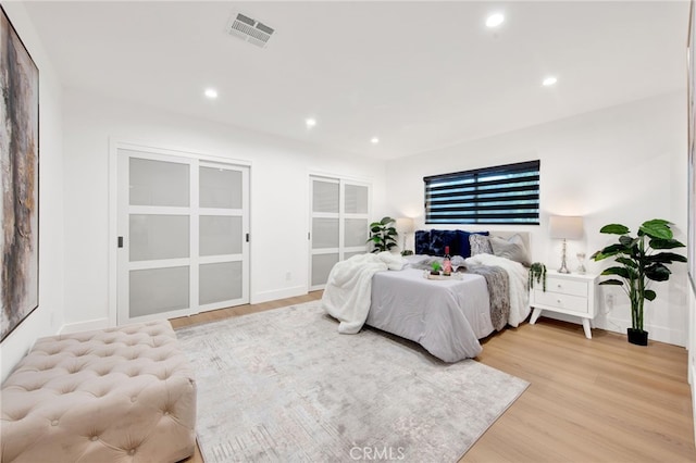 bedroom with light wood-type flooring