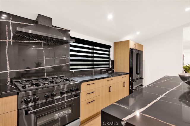 kitchen with ventilation hood, high end appliances, backsplash, and light brown cabinetry