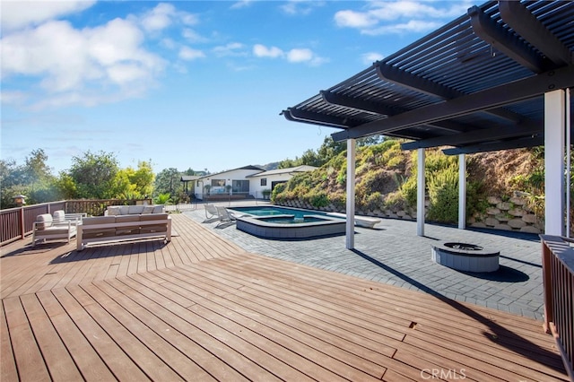 wooden deck featuring a pergola, outdoor lounge area, and a swimming pool with hot tub