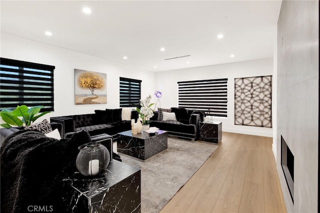 living room with light hardwood / wood-style floors