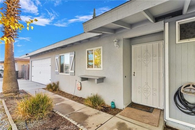 doorway to property featuring a garage