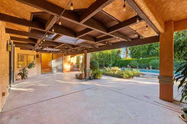 view of patio / terrace with a fenced in pool