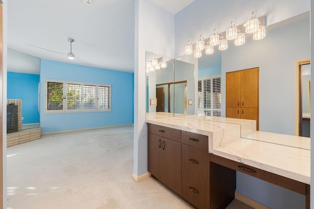 bathroom with vanity and a stone fireplace