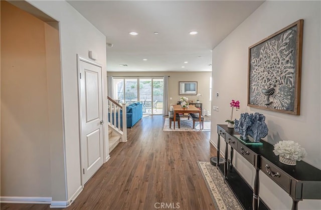 hallway with wood-type flooring