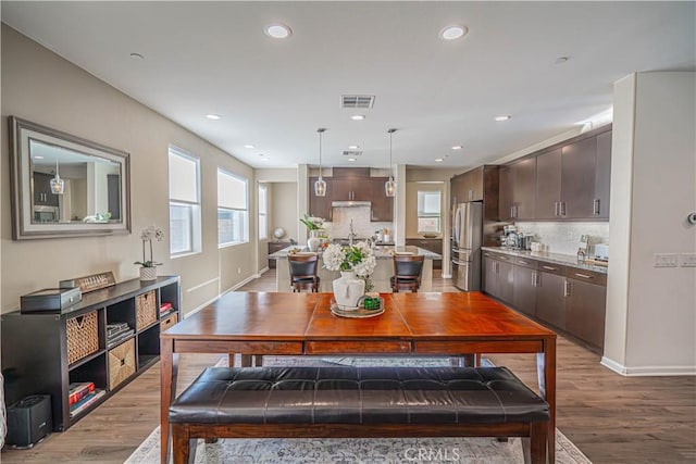 dining space featuring light hardwood / wood-style flooring