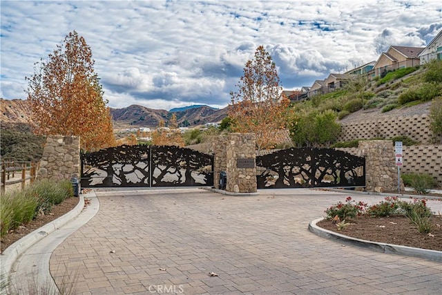 view of gate featuring a mountain view