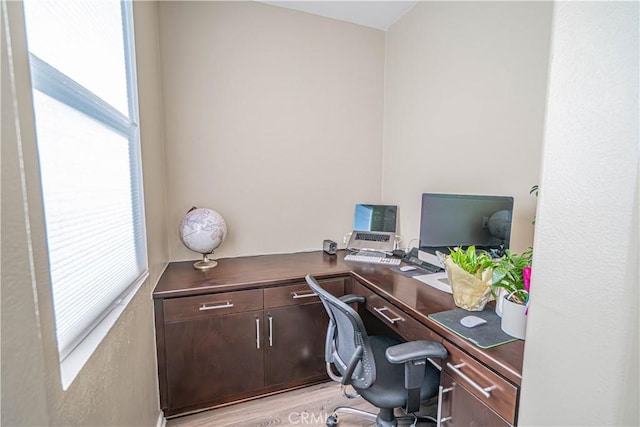 office area with light hardwood / wood-style floors