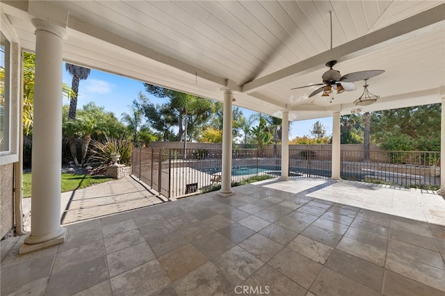 view of patio with a fenced in pool and ceiling fan