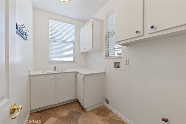 laundry area featuring cabinets, hookup for a washing machine, and sink