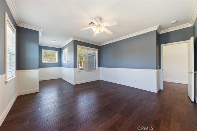 empty room with dark hardwood / wood-style floors, ceiling fan, and crown molding