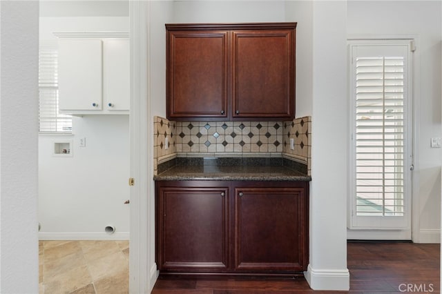 kitchen with decorative backsplash and hardwood / wood-style floors