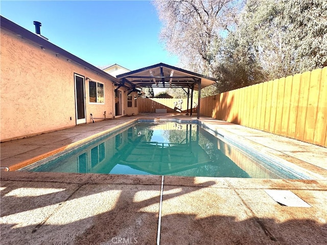 view of swimming pool featuring a patio area and a gazebo