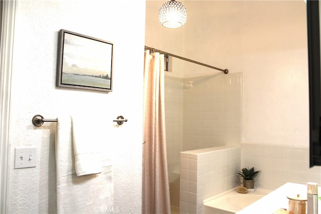 bathroom featuring plus walk in shower