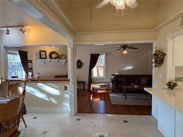 interior space with ceiling fan and light hardwood / wood-style floors