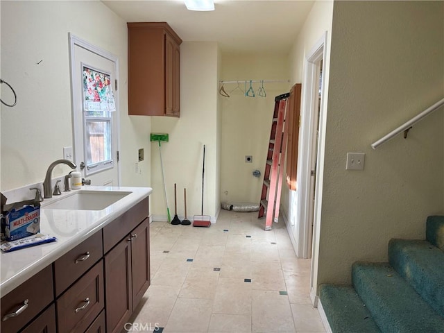 kitchen with light tile patterned floors and sink