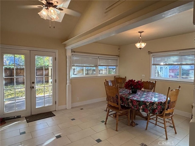 dining space featuring ceiling fan, vaulted ceiling, light tile patterned floors, and french doors