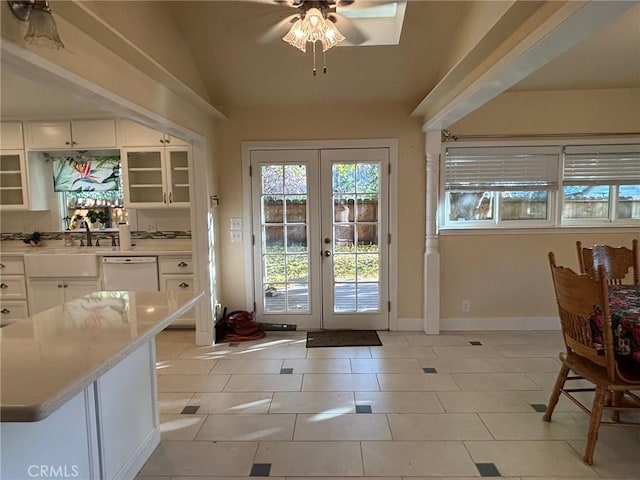 doorway to outside featuring lofted ceiling, french doors, sink, ceiling fan, and light tile patterned floors