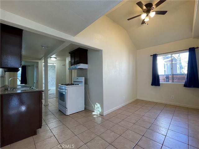 kitchen featuring lofted ceiling, sink, ceiling fan, light tile patterned flooring, and white range with gas cooktop