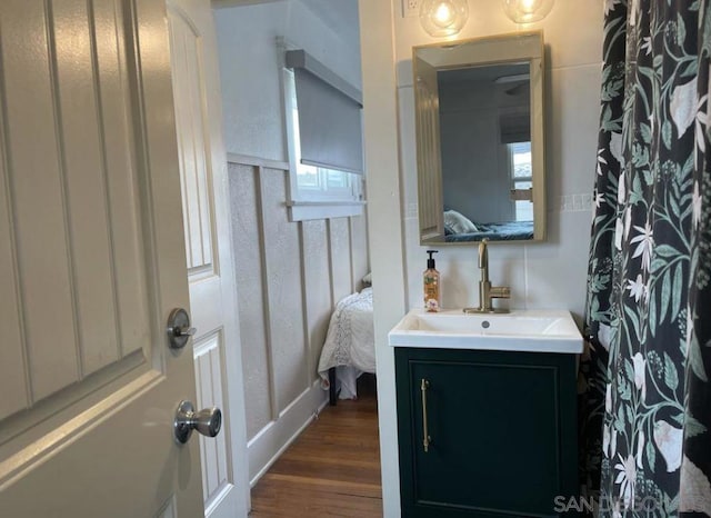 bathroom featuring hardwood / wood-style flooring and vanity