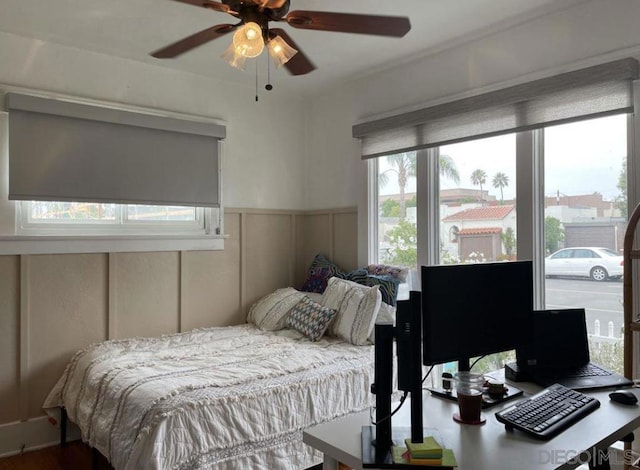 bedroom featuring hardwood / wood-style flooring and ceiling fan