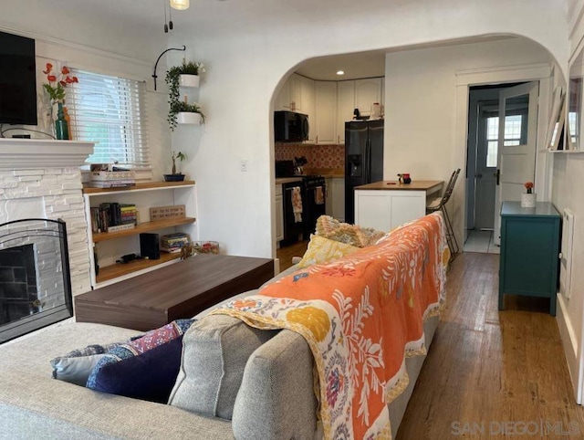 living room featuring a fireplace and hardwood / wood-style flooring