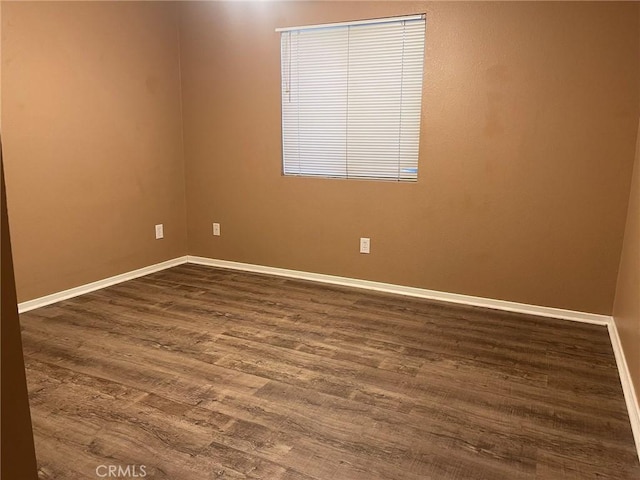 spare room featuring hardwood / wood-style flooring