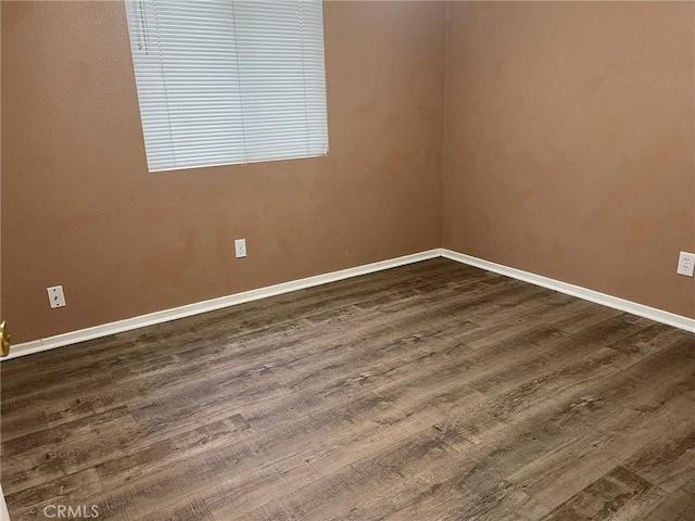 unfurnished room featuring wood-type flooring