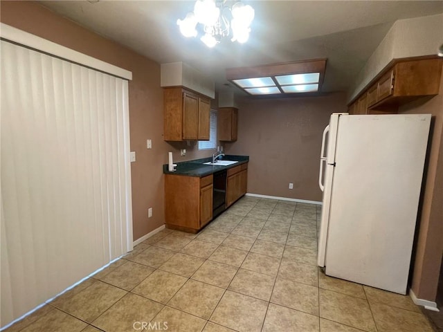 kitchen featuring black dishwasher, light tile patterned floors, a chandelier, and white refrigerator