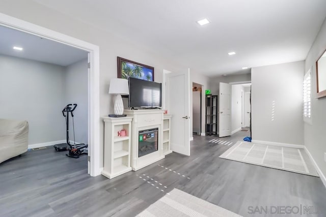 unfurnished living room with a fireplace and hardwood / wood-style flooring