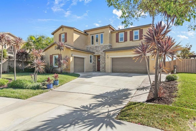 view of front of property featuring a garage and a front yard