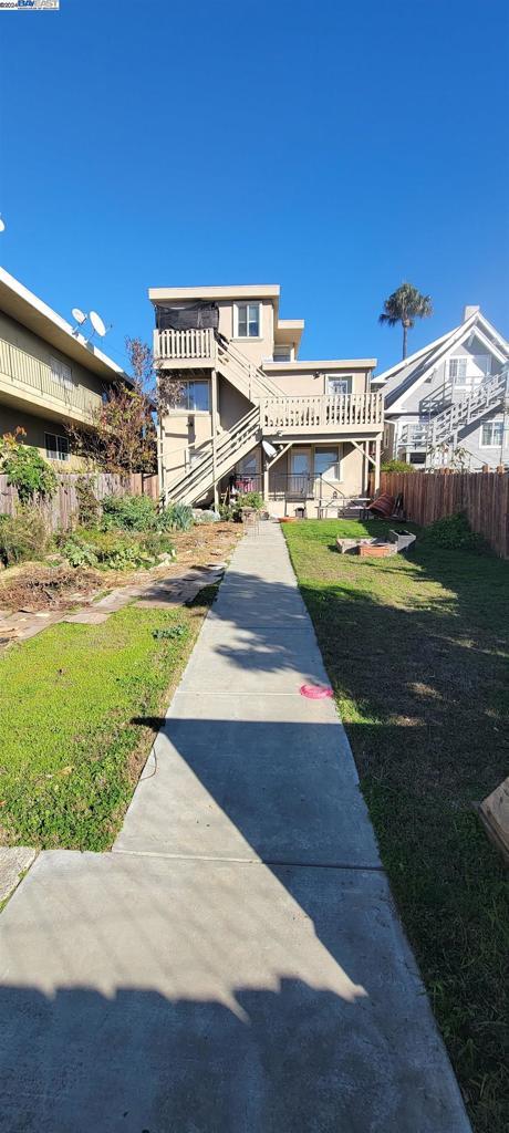 back of house with a lawn