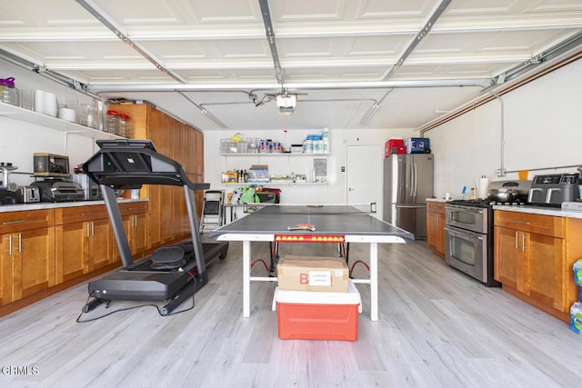 interior space featuring stainless steel fridge and a garage door opener