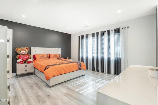 bedroom with light wood-type flooring